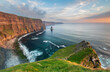 Panoramic view of cliffs at sunset with sky with colorful clouds
