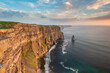 Panoramic view of cliffs at sunset with sky with colorful clouds