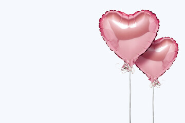 Pink air balloons heart shape on a white background. Concept wedding, valentines day, photo zone, lovers. Banner. Flat lay, top view