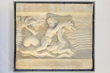 Poster - Nice little reliefs with putti and sea monsters.