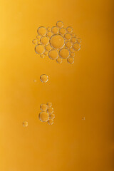 Sticker - A top view closeup of multiple bubbles on an orange background