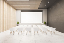 Interior Of A Presentation Room With White Chairs And Blank Screen.