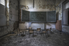 A Ruined Classroom With Dirty Aged Walls Of An Abandoned School