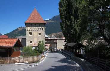 Wall Mural - Medieval Tauferer Tor city gate with a covered bridge in the old town of Glurns in Vinschgau region, South Tyrol in Italy