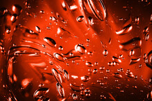 Red Water Gel Background. Abstract Round Bubble Shapes Fizzy Liquid Pattern. Water Fluid Red Texture. Bright Back Light Spa Water. Abstract Fluid Jelly Background.
