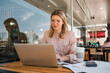© Mego-studio - Young businesswoman working on her laptop.