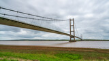 Grey clouds over the Humber Bridge, seen from Barton-Upon-Humber in North Lincolnshire, England, UK