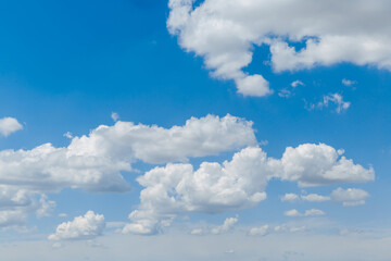 Wall Mural - blue clear sky with white fluffy clouds. natural background. copy space