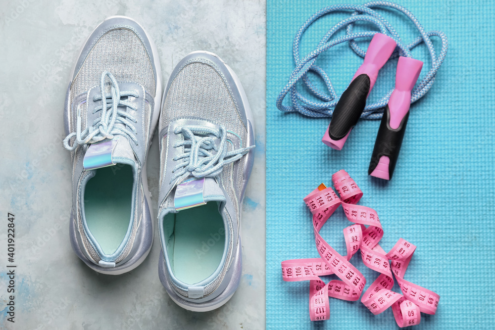 Set of sport equipment on color background