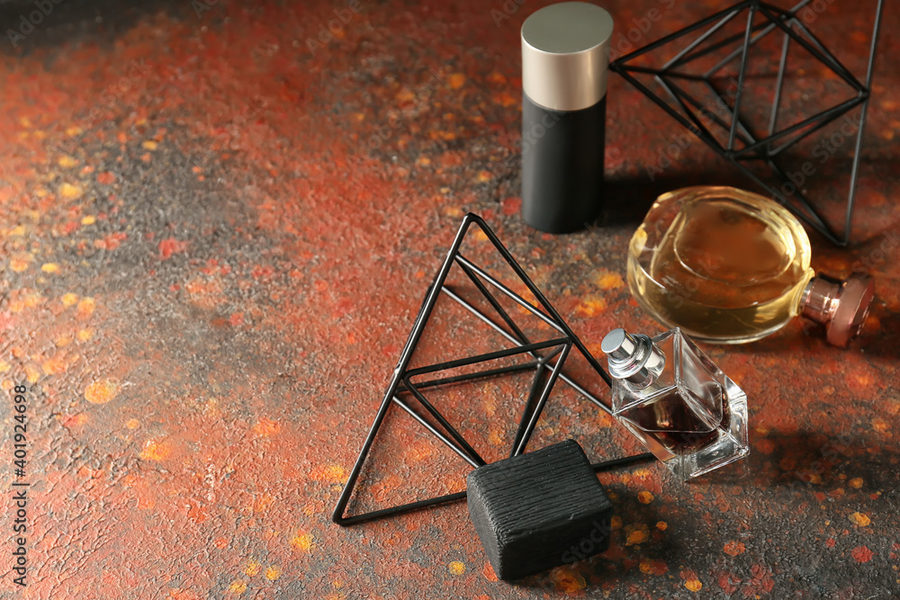 Bottles of perfume on grunge background