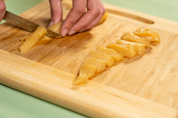 Sticker - A chef cutting free-range chicken breast on a chop