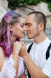 © angel_nt - Couple in love is sitting on the stairs and embracing. Love and relationships between men and women