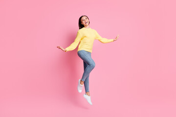 Poster - Full size photo of young beautiful happy smiling positive good mood girl jump fly isolated on pink color background