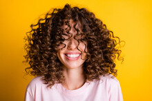 Headshot Of Laughing Cheerful Girl With Curly Hairstyle Wearing T-shirt White Toothy Smile Isolated On Bright Yellow Color Background