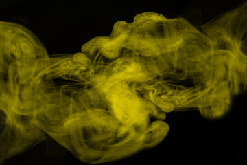 Yellow steam on a black background.