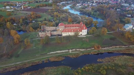 Wall Mural - Bauska Medieval Castle Ruins Complex and Park From Above Aerial Shot. Ruins of the Livonian Part of the Bauska Castle, Latvia in Autumn. Castle Was Built in the Middle of the 15th Century