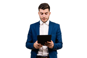 White businessman with brunette hair isolated on a white background looking and touching the tablet