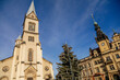 Church of the Assumption of the Virgin Mary and Neo-Renaissance town hall, Christmas market at Square Namesti starosty Pavla in Kladno in sunny day, Central Bohemia, Czech Republic