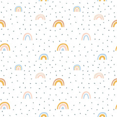 Abstract rainbow seamless pattern illustration. Soft pastel color doodle rainbows in childish freehand style for children or cute background design.