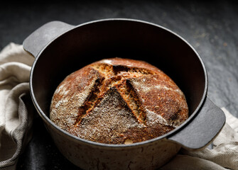 Homemade sourdough bread baked in dutch oven, close up view