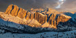 Beautiful wide panorama of snow capped mountains at sunset