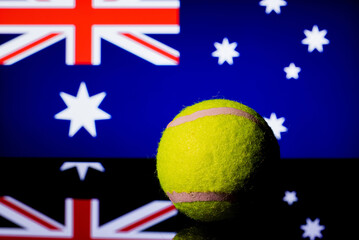 Wall Mural - A closeup shot of a tennis ball on a Uk flag background