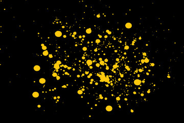 Wall Mural - an abstract black background with yellow paint splatters for wallpapers