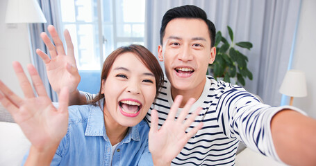 Poster - Asian couple has video chat