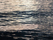Waves at the seashore at sunset. Selective focus with shallow depth of field.