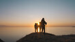 © realstock1 - The four tourists walking near the sea on the beautiful sunset background