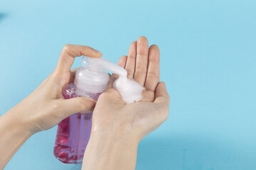 Poster - A closeup shot of a person washing their hand with liquid soap