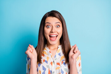 Poster - Photo of cute young girl open mouth raise arms crazy face wear geometry print shirt isolated blue color background