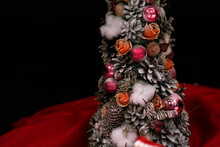 Handmade Christmass Tree With Cones And Pink Christmas Balls On Dark Background