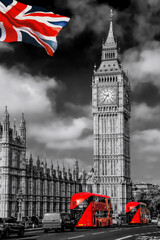 Fototapete - Big Ben with red buses on the bridge against flag of England in London, England, UK