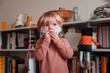 © Nektarstock - Child Putting on Face Mask at Home