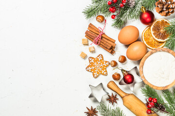 Christmas baking background on white table. Ingredient for cooking christmas pastry, cookies or pie. Top view with copy space.