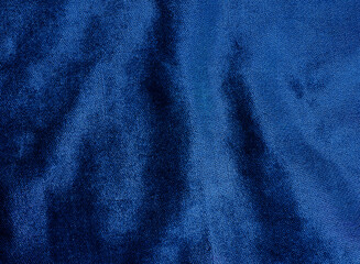 classic blue velvet fabric for background. abstract wavy shiny fabric for luxury concept background.
