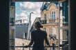 © Alexandra Phillips - Woman overlooking Paris in Window