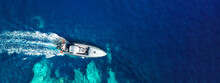 Aerial Drone Ultra Wide Photo Of Inflatable Rib Power Boat Cruising In High Speed In Tropical Exotic Bay With Coral Reef And Deep Blue Sea