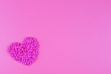 Heart of sweet confetti on pink background, Valentine's Day, love concept