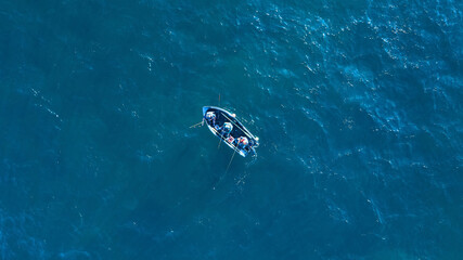 Wall Mural - aerial top view photo of fishing boat