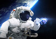 Astronaut on the orbit trying to catch digital earth ball globe. Elements of this image furnished by NASA