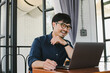 © panitan - man work using computer hand typing laptop keyboard contact us online chatting search form internet sitting at office.concept for technology device communication business people