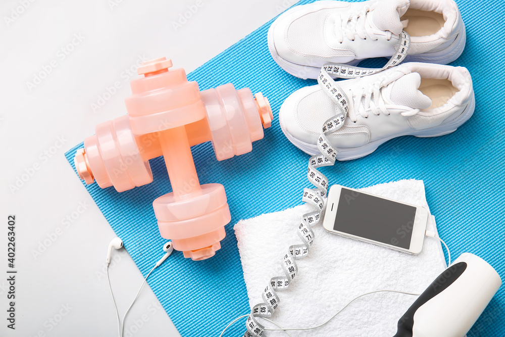 Sports equipment on color background