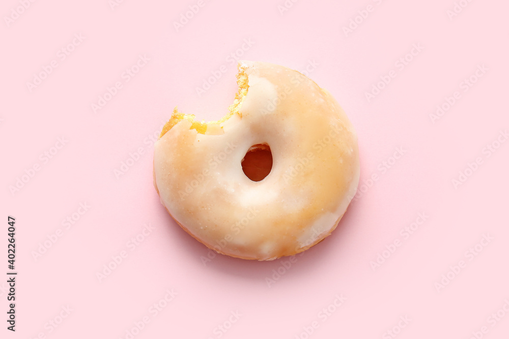 Tasty donut on color background