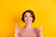 Close up photo of attractive lady looking empty space indicate two finger up isolated on vivid yellow color background