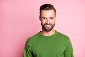 Canvas Print - Close-up portrait of attractive cheerful content mature bearded guy wearing green pullover isolated over pink pastel color background