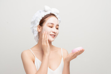 beautiful girl in the bathroom and mask for facial skin care