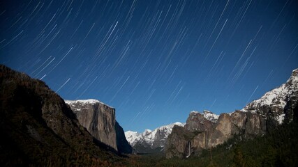 Wall Mural - nighttime star trails time lapse at yosemite national park.