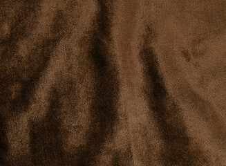 brown velvet fabric texture for background. abstract wavy shiny fabric for retro or classic concept background. 